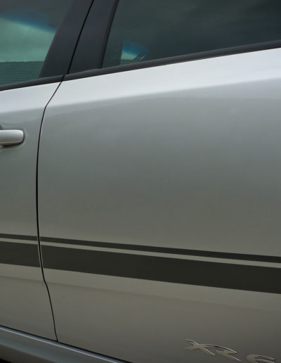 Silver XR6 passenger side after three stage detailing