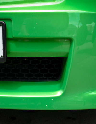 Front bumper before paint chip repairs