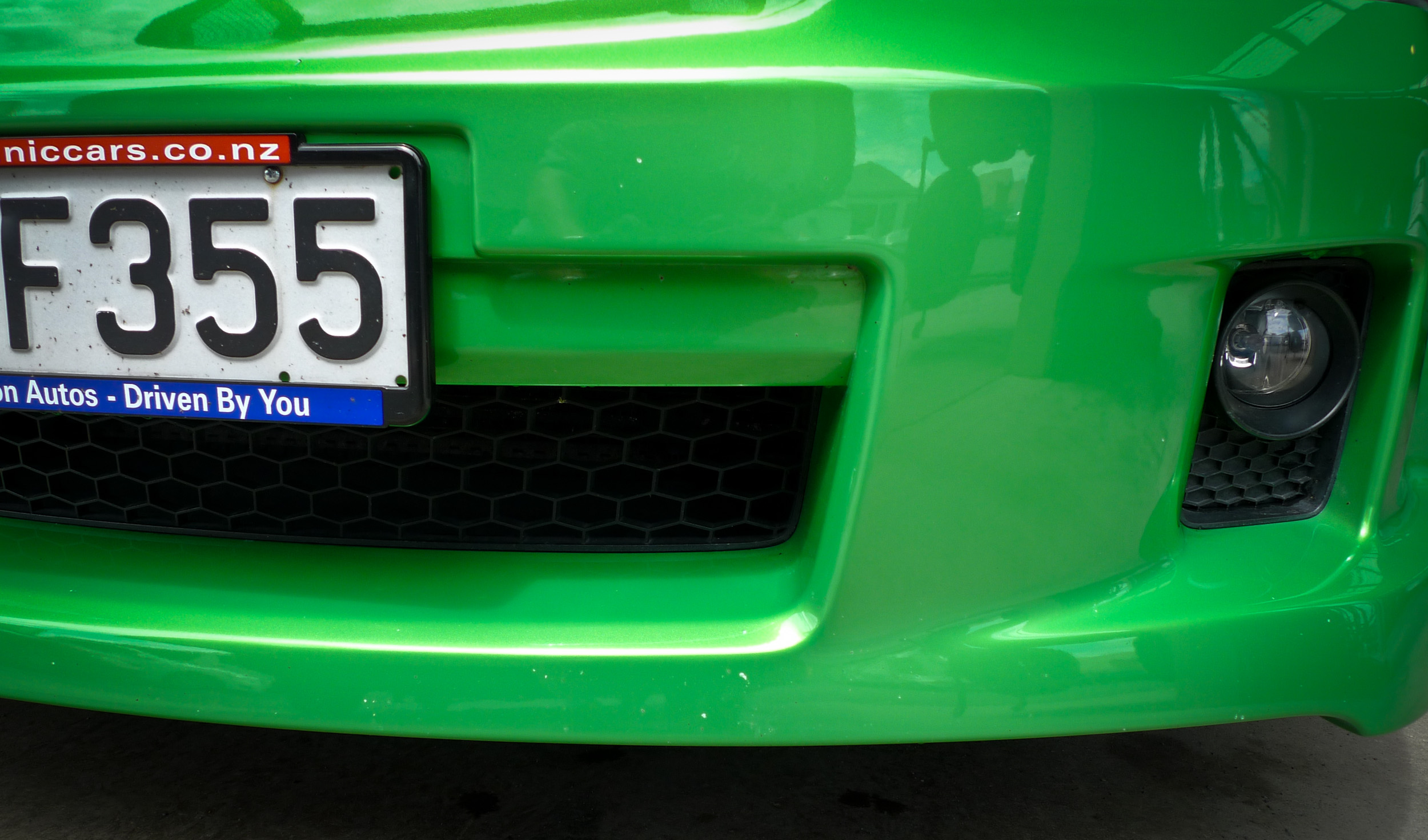 Front bumper before paint chip repairs