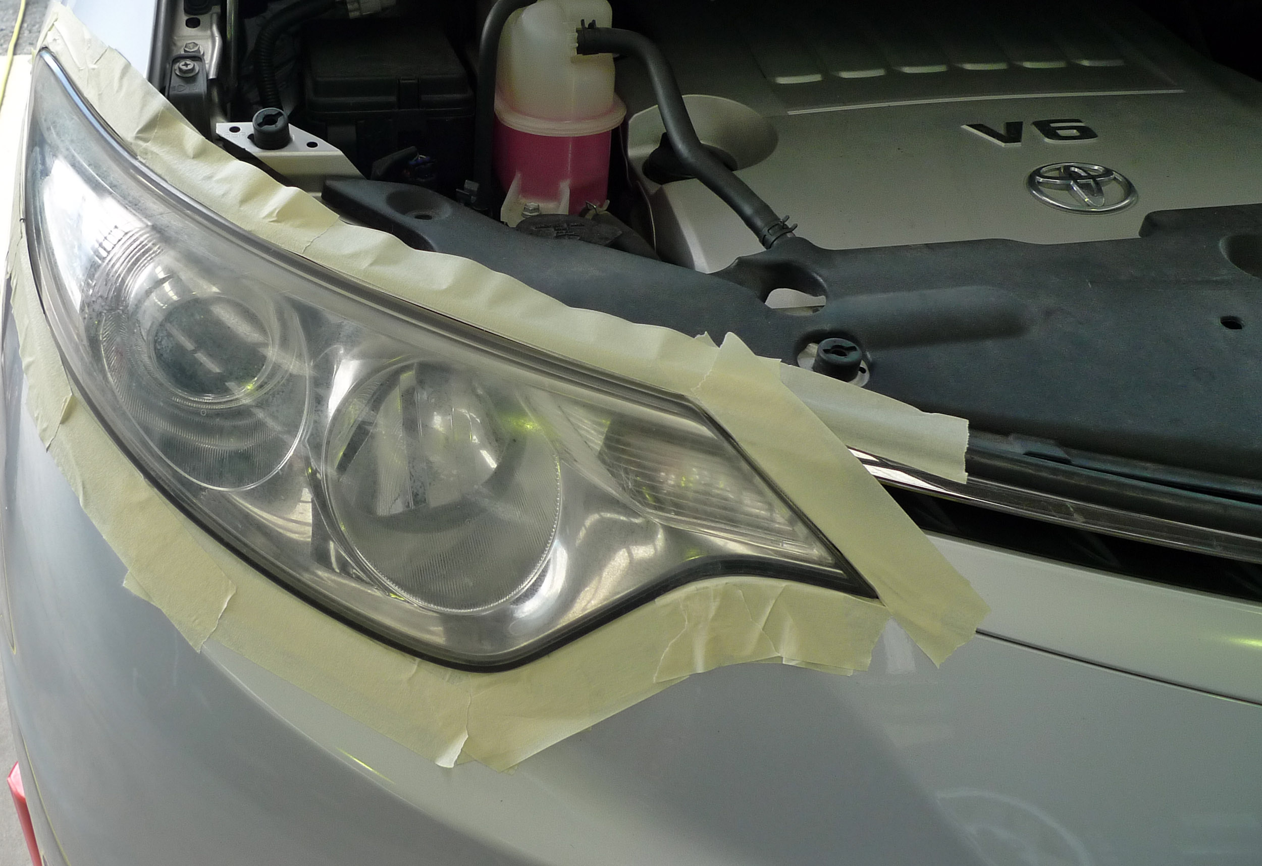 Right front headlight before repair