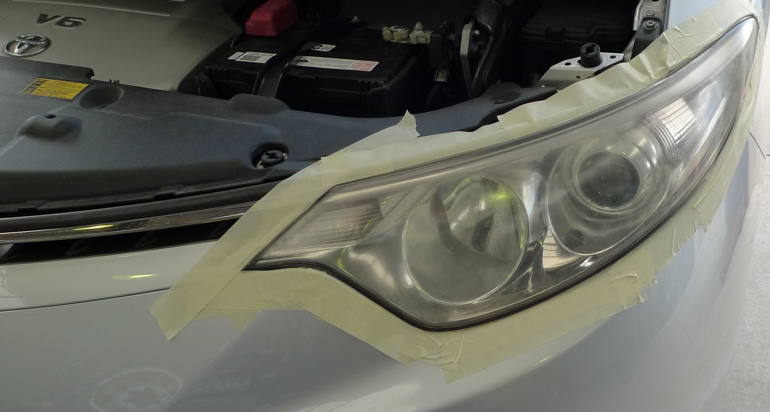 Left front headlight before repair