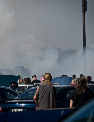 Crowds watching tyre burn out