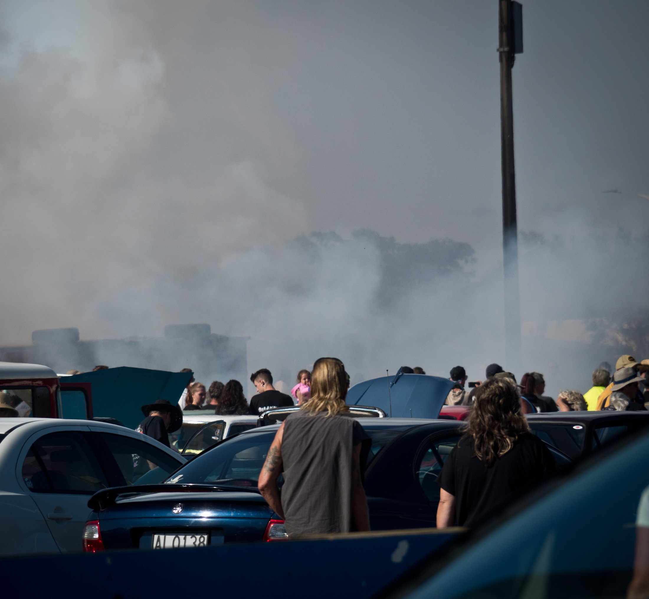 Crowds watching tyre burn out