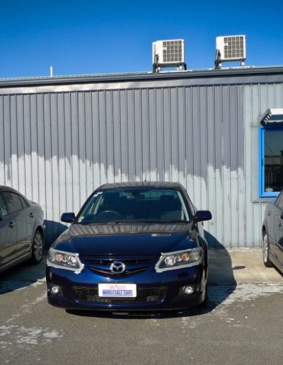 Three vehicles waiting for headlight repair