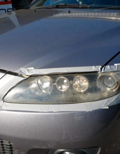 Left headlight before repair