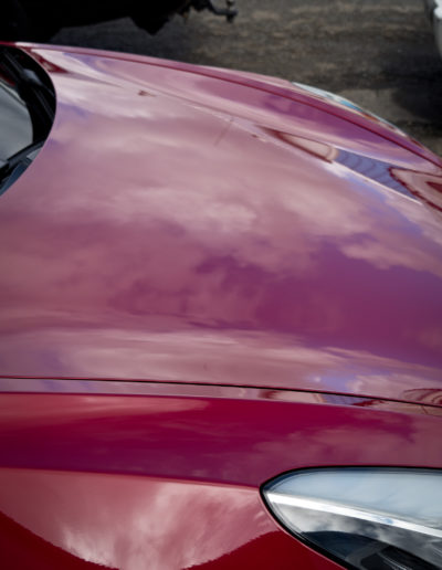 Clouds reflecting on bonnet and front guard