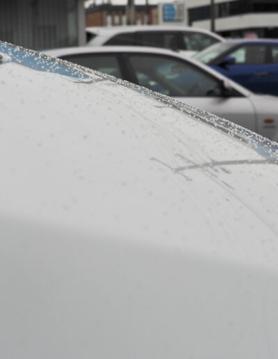 Close up of rain water droplets on bonnet of motorhome after coating applied