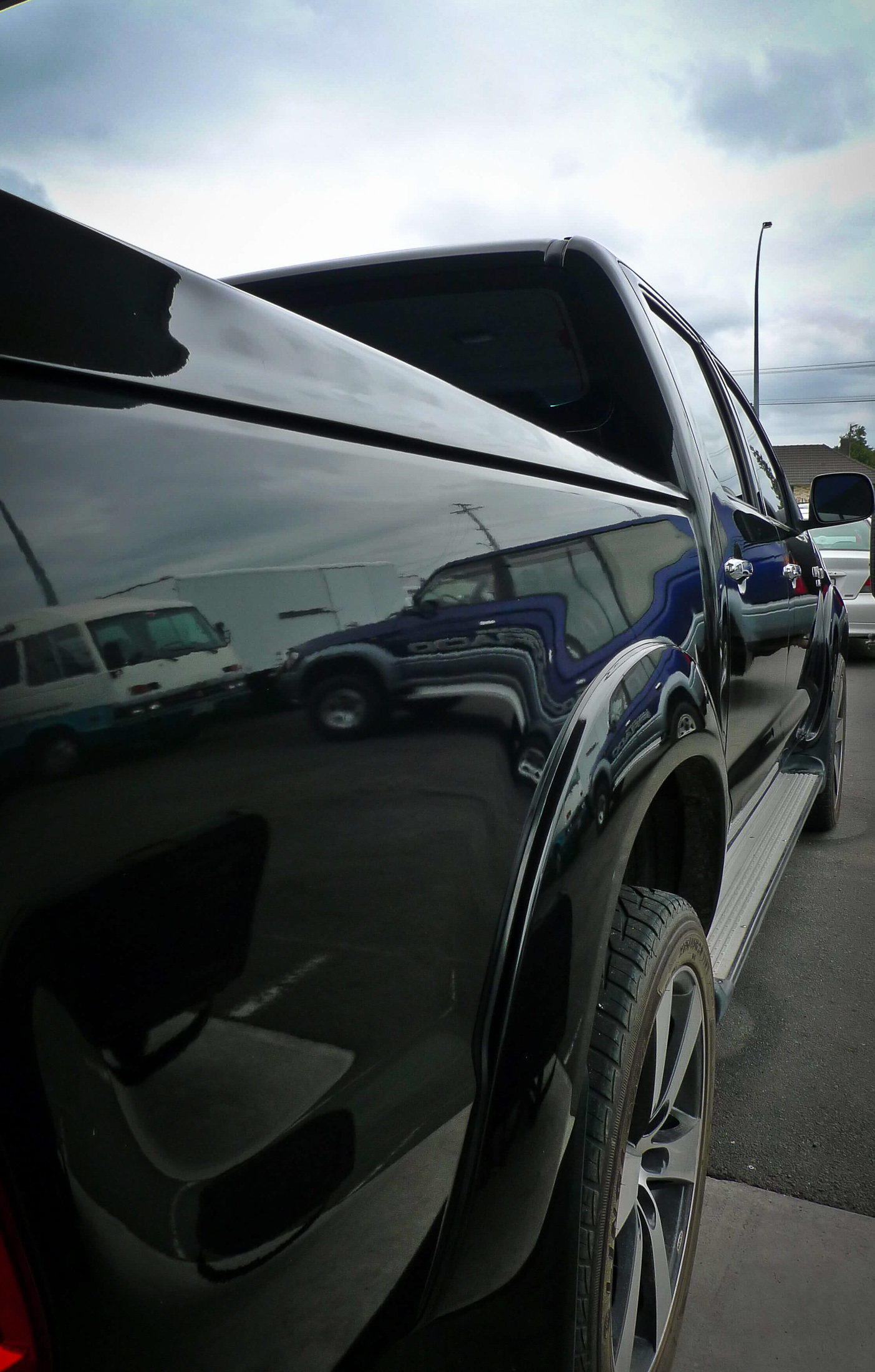 Right rear and side view with reflection on paint