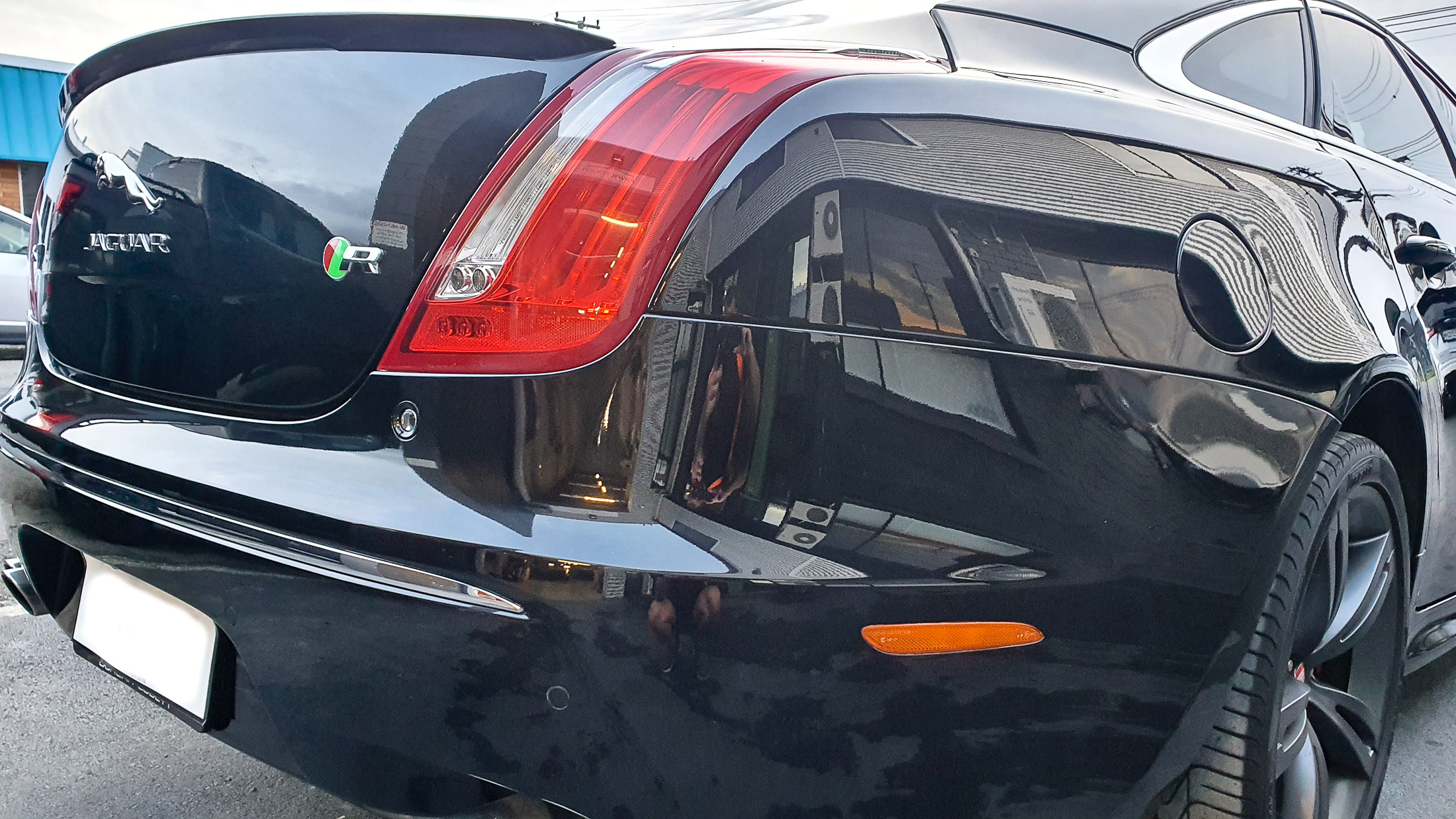 Right rear and boot lid after coating applied showing deep black with high-gloss finish