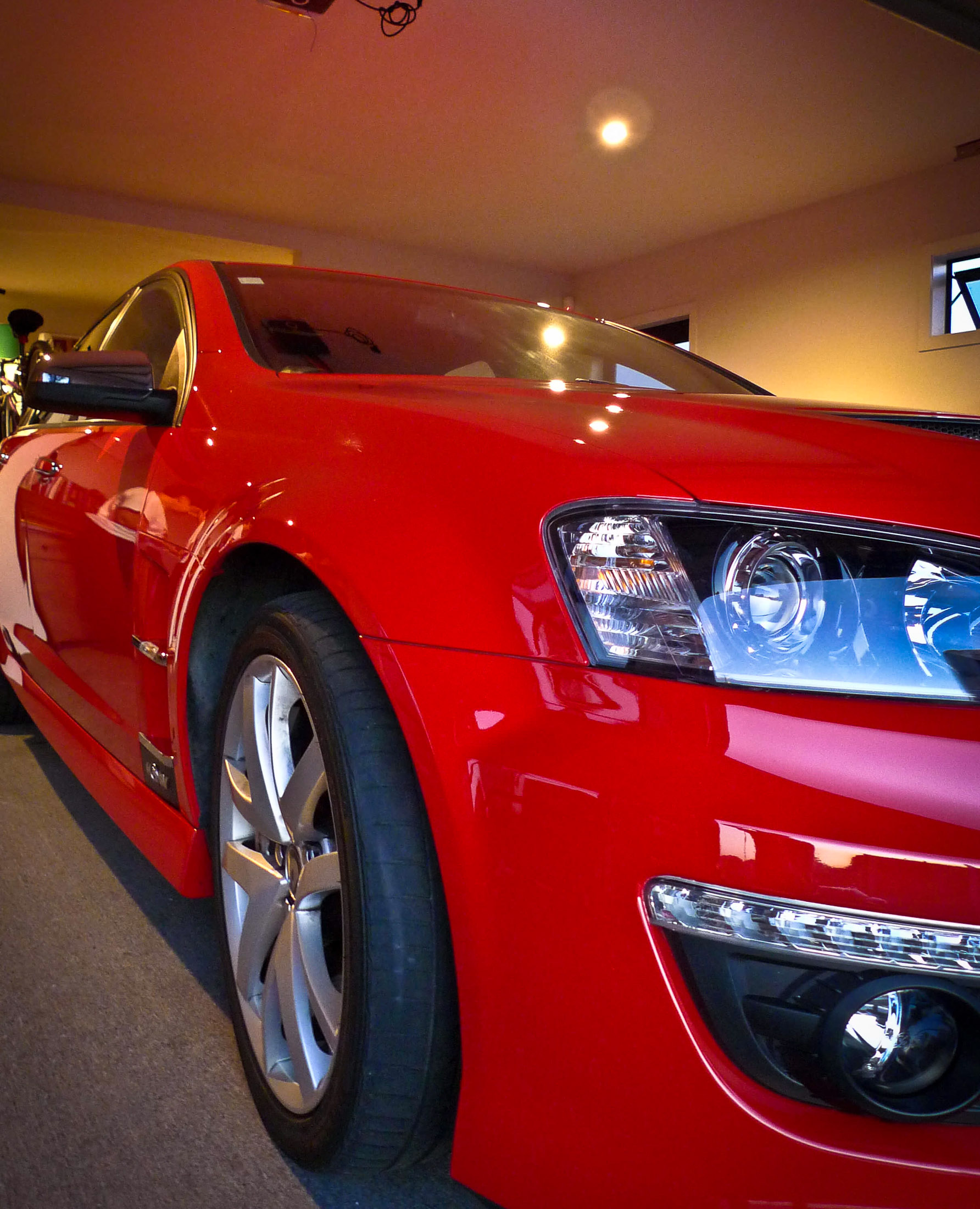 Right front bumper and guard with reflections in paint after detailing