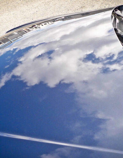 Reflections of clouds in bonnet after detailing