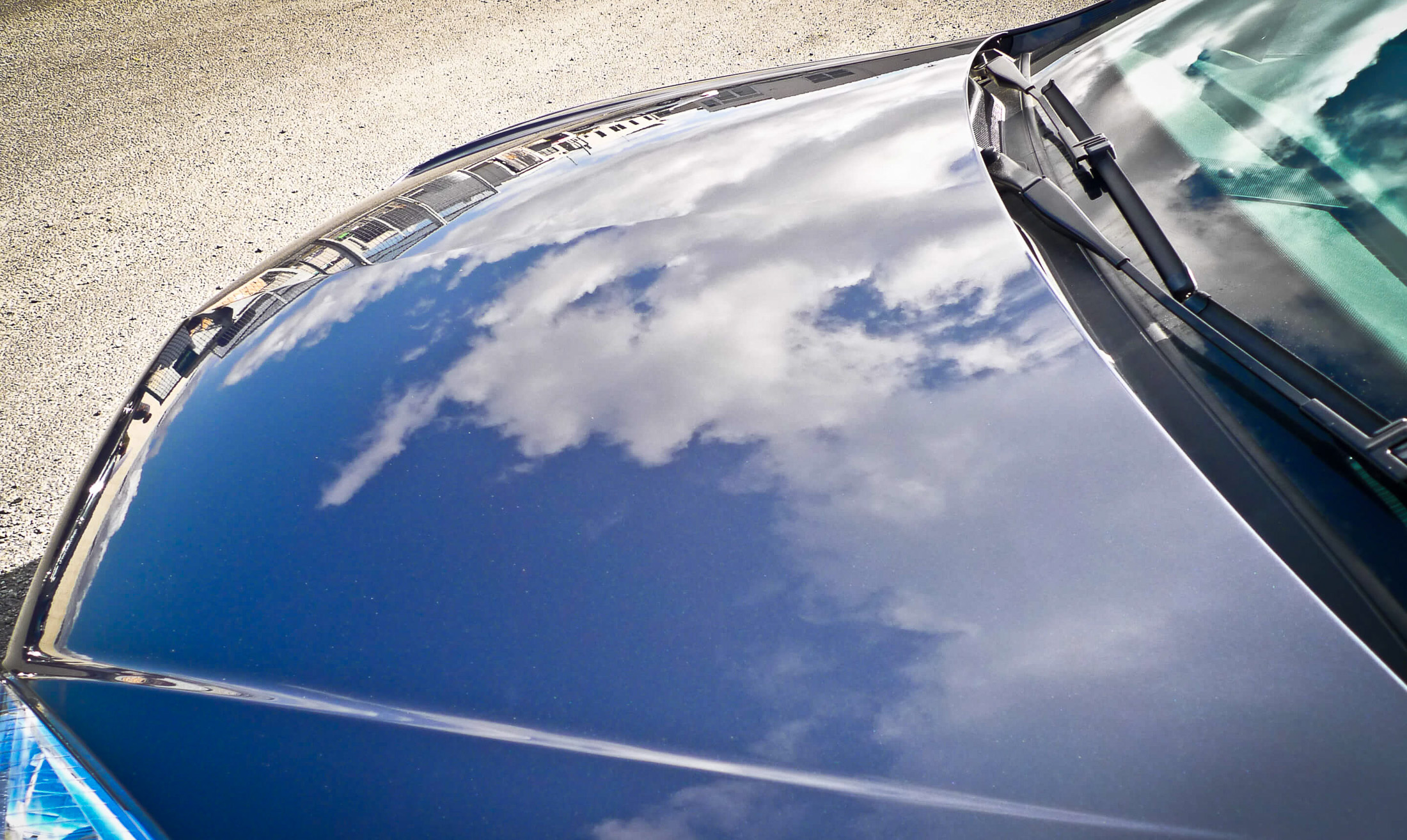 Reflections of clouds in bonnet after detailing
