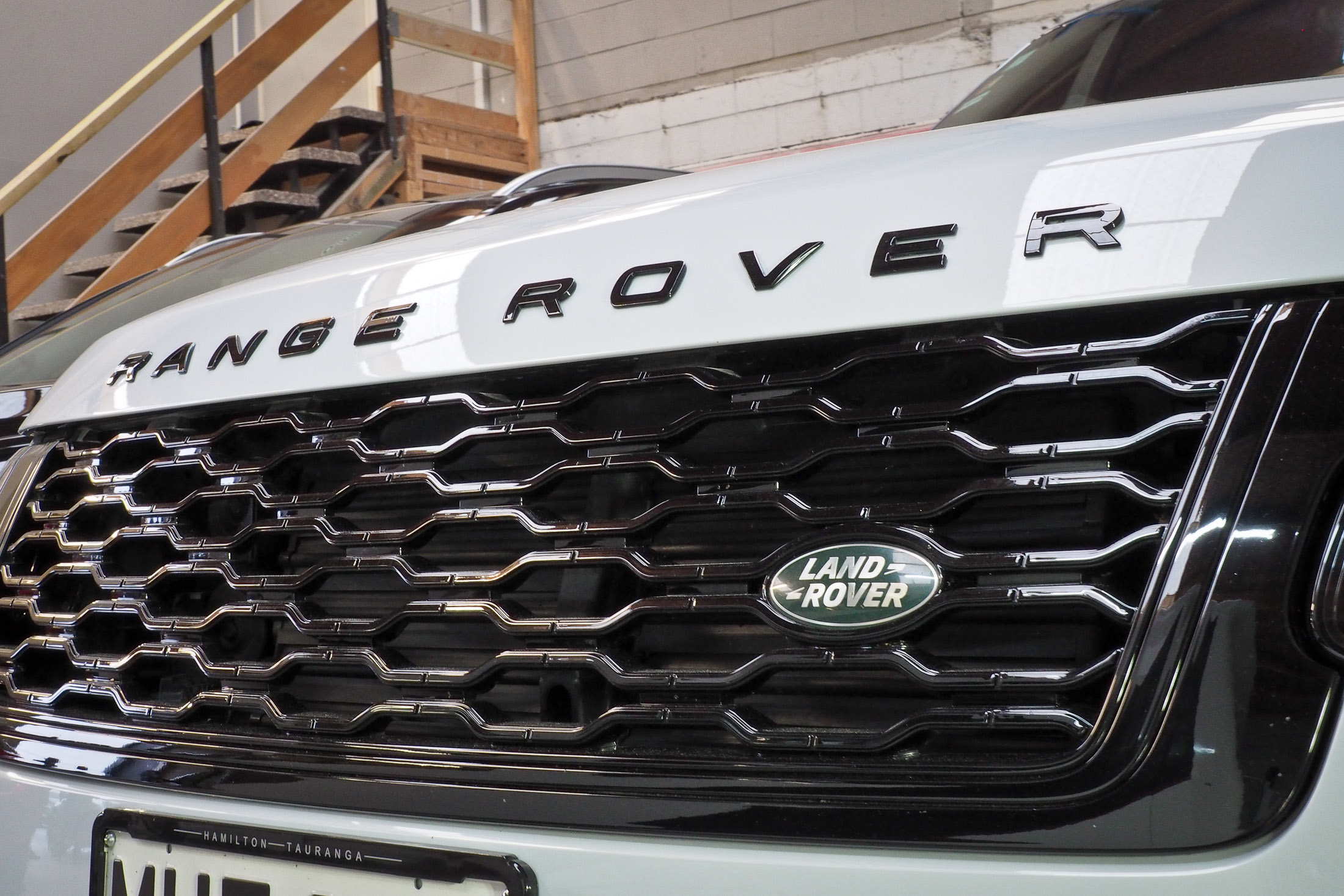 Close up of grill and bonnet badges