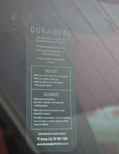 Close up of Dura-Seal mirror hanger card