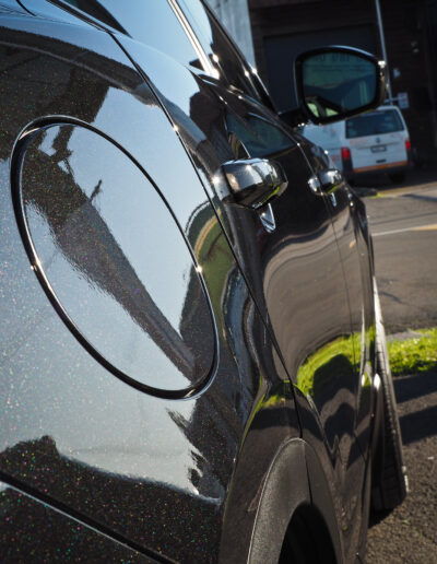 Close up of fuel cap cover and reflection on right side