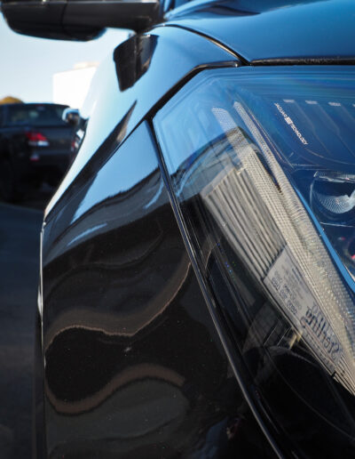 Front right headlight looking backward down car