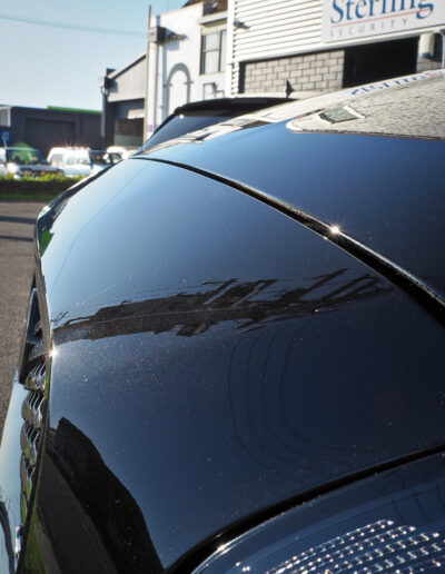 View over bonnet with power pole reflecting on bonnet