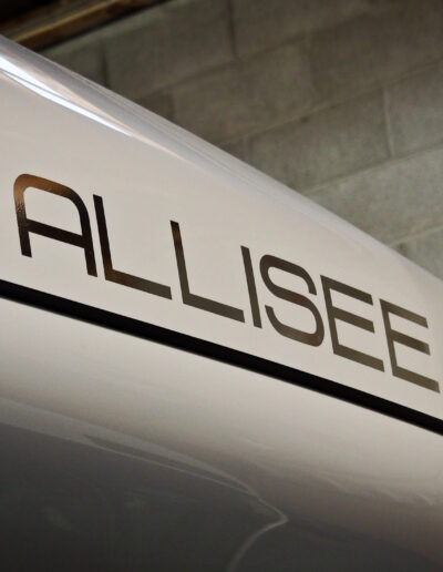 Looking upward towards ALLISEE logo on roof from right side