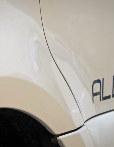 Close up of front left guard and ALLISEE sign on door